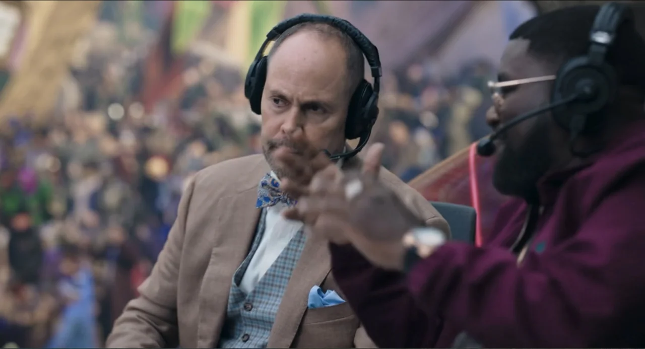 Space Jam: A New Legacy (2021) movie still: medium — Two men wearing broadcast headsets sit side by side in a professional commentating environment.…