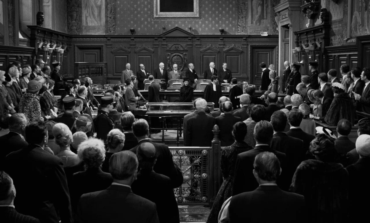La Verite (1960) movie still: wide — A large ornate wood-paneled courtroom filled with a crowd of people in formal attire. Judges sit at the far end…
