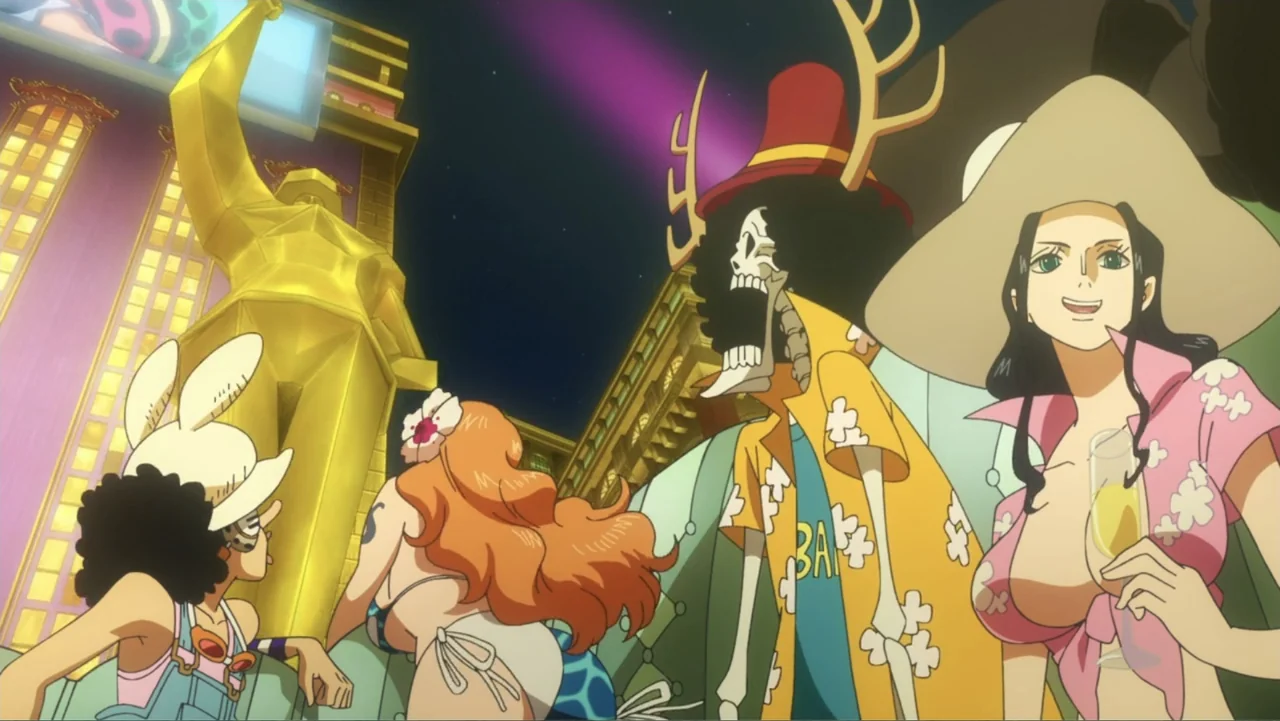 One Piece Film: GOLD (2016) movie still: medium — An outdoor plaza at night features a large golden statue and decorated buildings. Four characters…