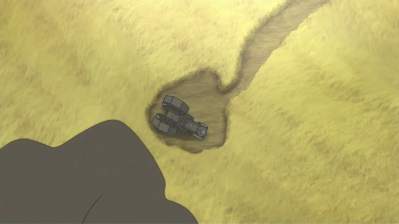 Superman: Red Son (2020) movie still: establishing — A top-down view shows a vast yellow wheat field with a dirt path cutting through. A single dark…