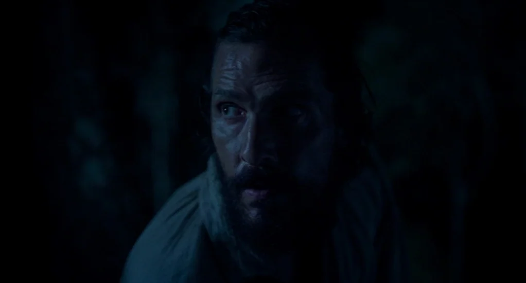 Free State of Jones (2016) movie still: closeup — A man stands in a dark wooded area at night. He stares off-camera with a wide-eyed expression.