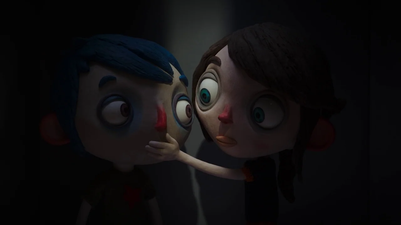 My Life as a Zucchini (2016) movie still: medium — A dark, dimly lit environment features two stop-motion animation puppet characters. The girl…