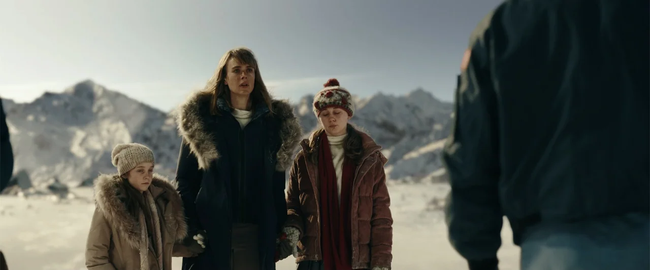 Moonfall (2022) movie still: medium — A group of three females stands in a bright, snow-covered mountainous environment. They face a person whose…