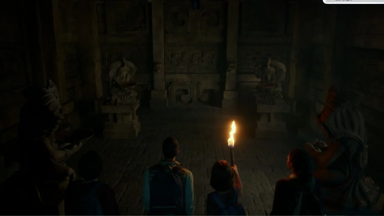 Dora and the Lost City of Gold (2019) movie still: medium — A dark stone temple chamber features intricate wall carvings and multiple ancient stone…