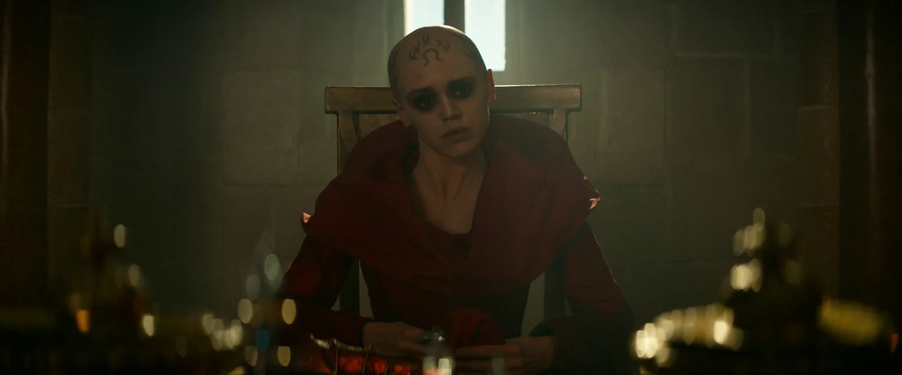 Dungeons & Dragons: Honor Among Thieves (2023) movie still: medium — A dimly lit stone room features a single high-backed wooden chair against a…