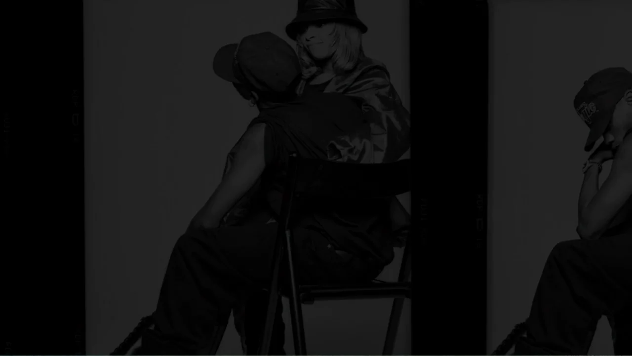 Mary J. Blige's My Life (2021) movie still: medium — A minimalist studio space with a single chair against a plain backdrop. A man and a woman are…