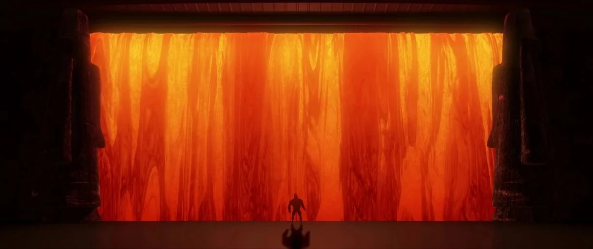 The Pixar Story (2007) movie still: wide — A dark subterranean chamber contains a massive, cascading wall of glowing molten lava. A lone muscular…