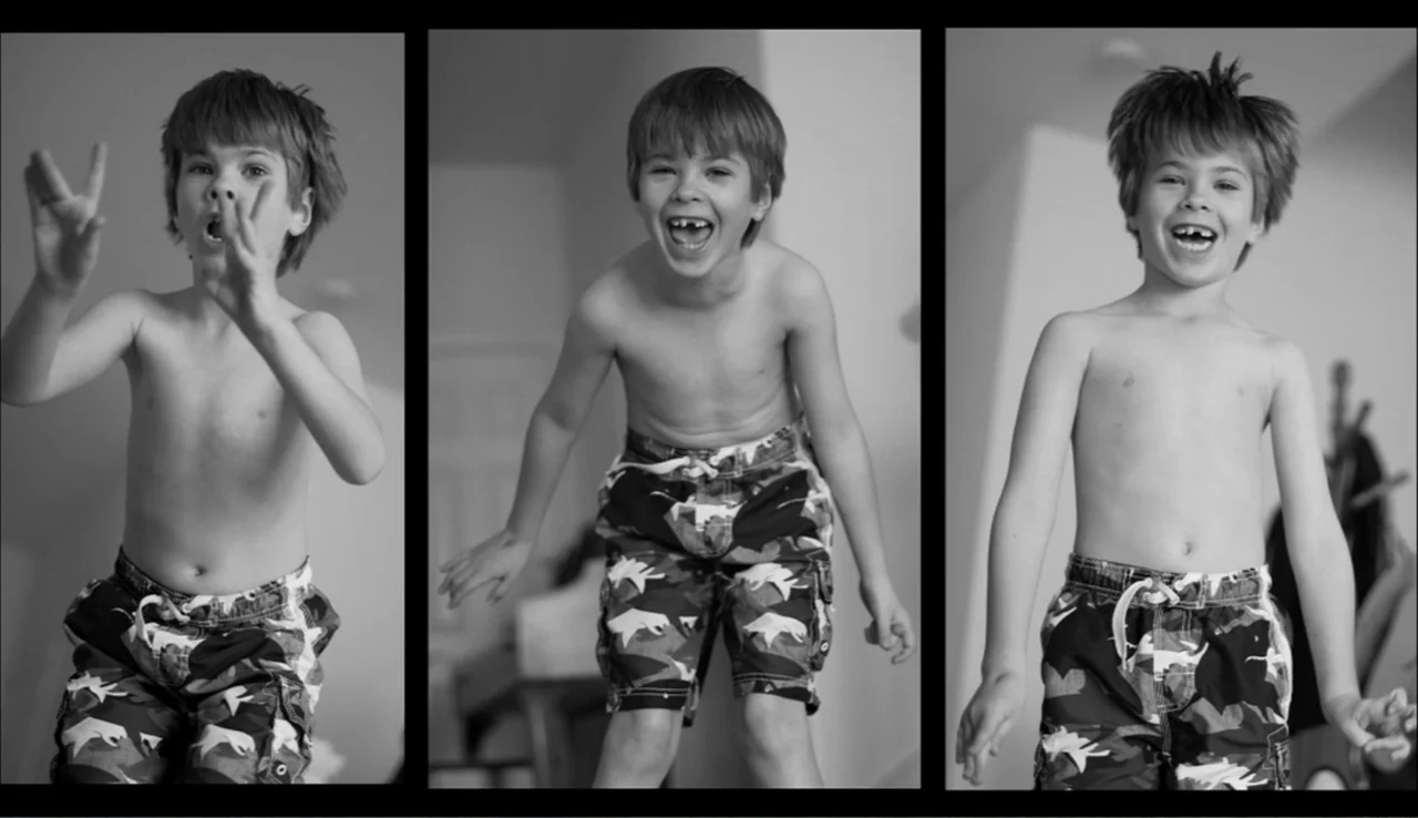 Dark Light: The Art of Blind Photographers (2009) movie still: medium — A light-colored residential interior features a young boy in three different…