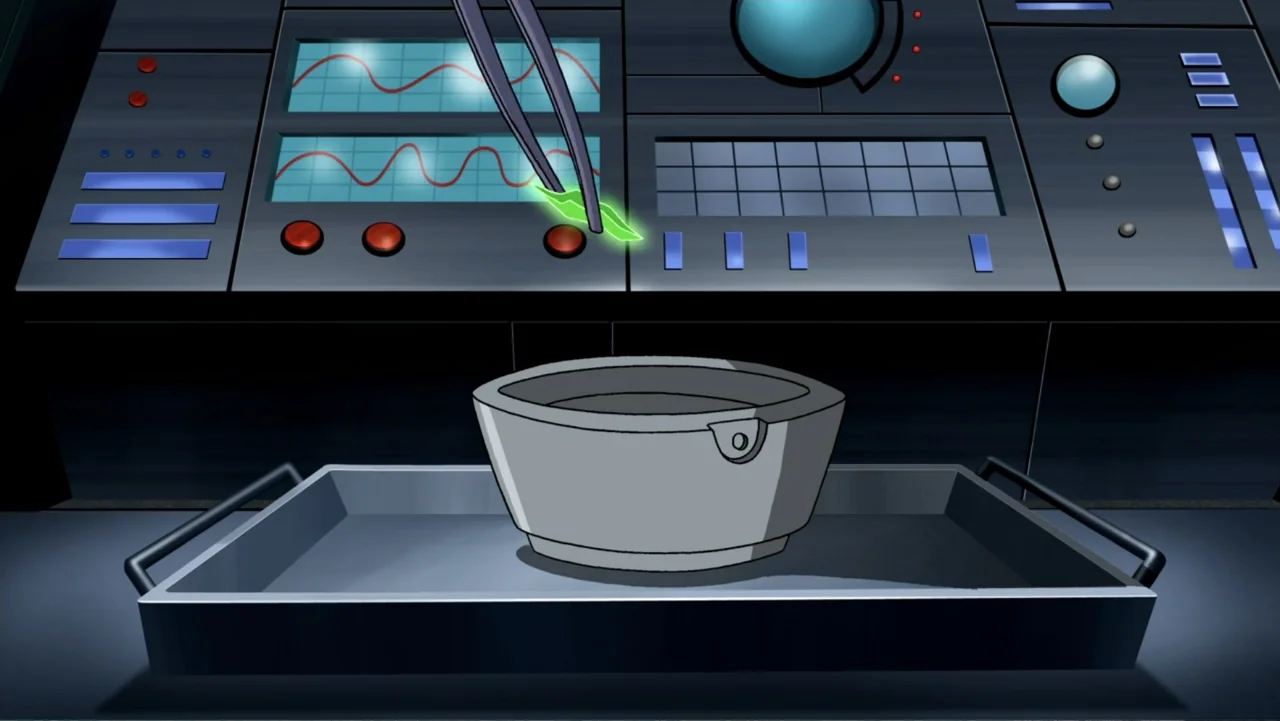 Superman/Batman: Public Enemies (2009) movie still: closeup — A high-tech laboratory station features a dark console with glowing digital readouts.…