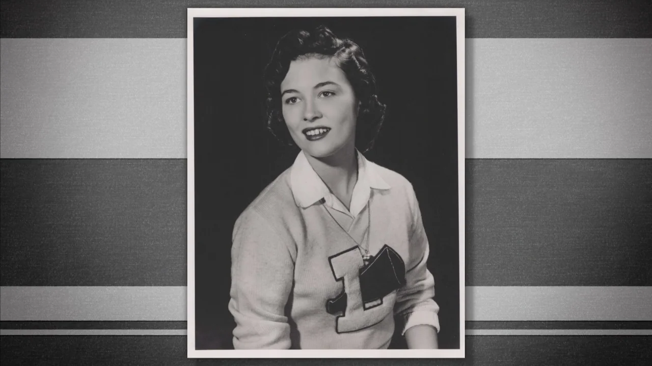 Faye (2024) movie still: medium — A vintage monochromatic studio photograph featuring a young woman posing against a dark background. The subject…