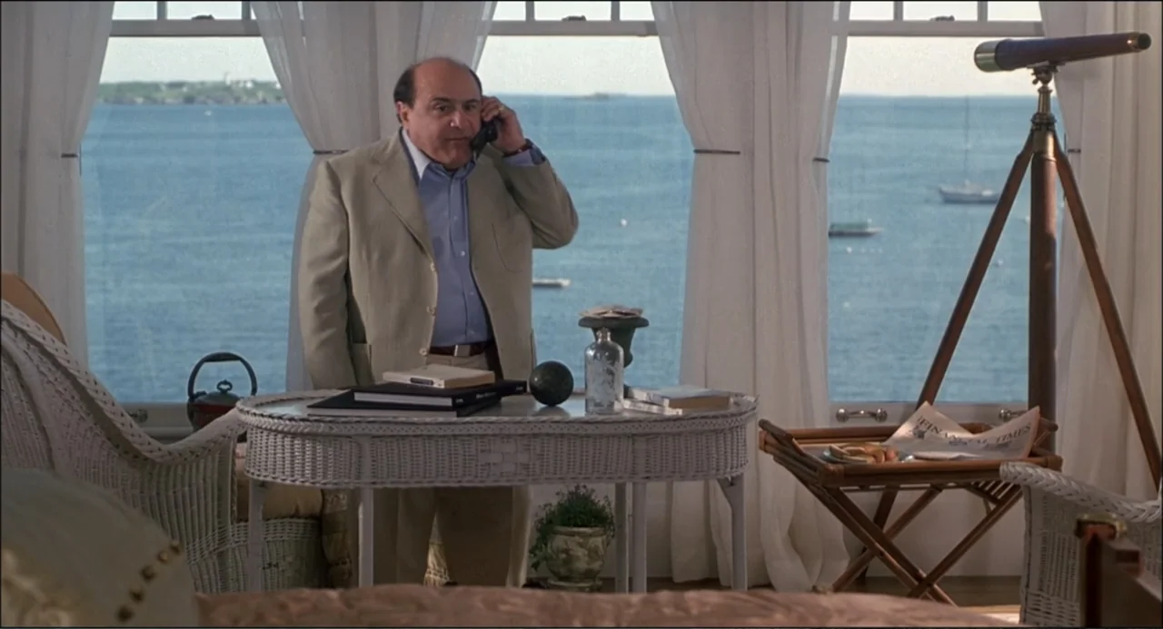 What's the Worst That Could Happen? (2001) movie still: medium — A light-filled sunroom overlooks a vast blue ocean through large windows with white…