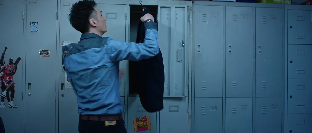 Line Walker (2016) movie still: medium — A row of grey metal lockers stands in a dimly lit room.