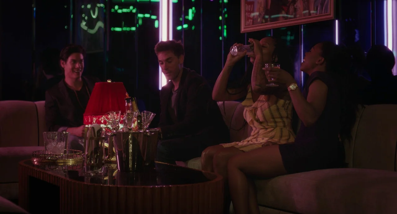 Test Pattern (2019) movie still: medium — A dimly lit club seating area features neon green light accents and plush furniture. Two men and two women…