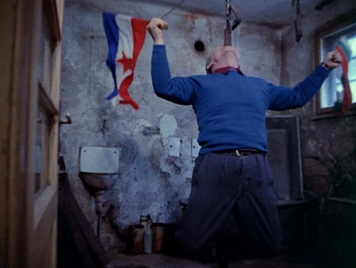 Innocence Unprotected (1968) movie still: medium — A rustic, dilapidated room with exposed stone walls and a small window. An elderly man is…