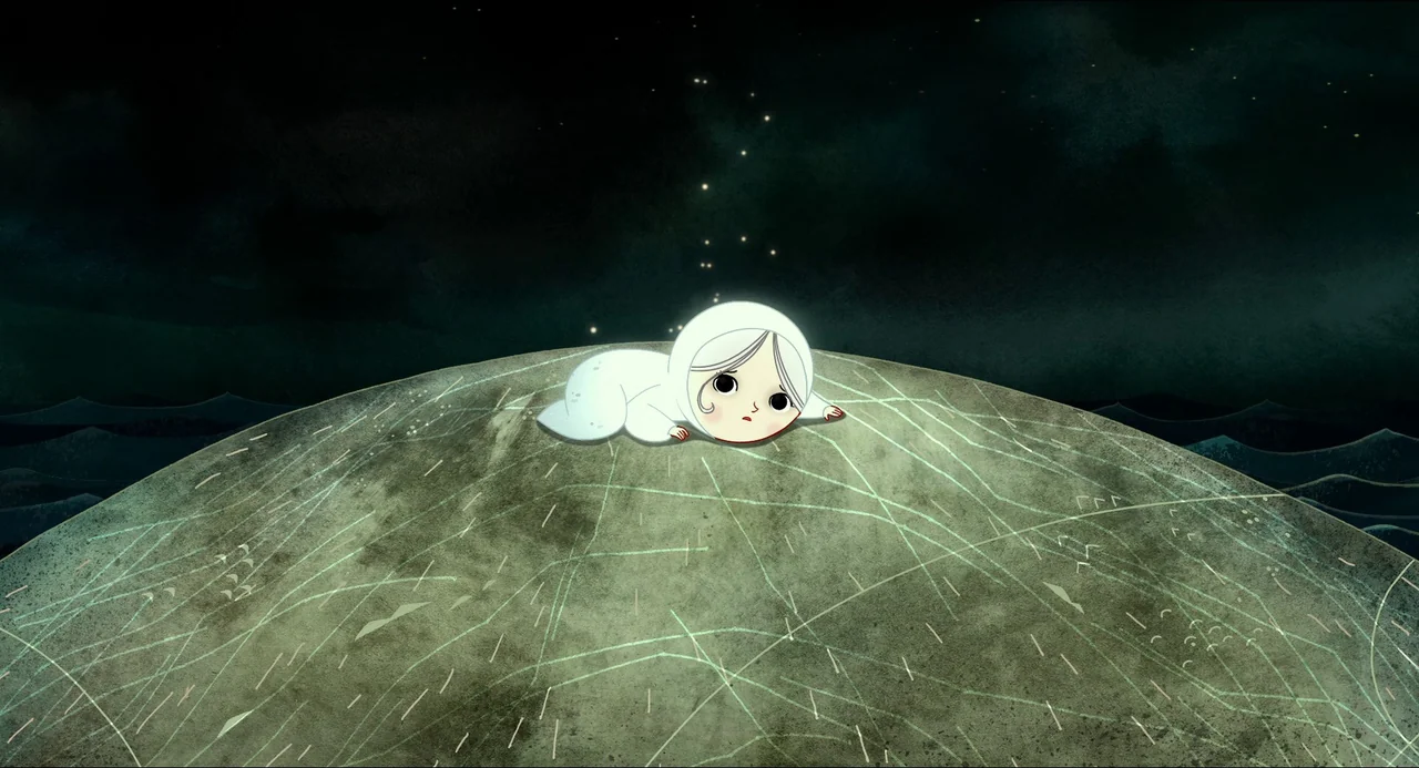 Song of the Sea (2014) movie still: wide — A desolate rock island sits in a dark, stylized ocean under a black sky. A small girl in a white hood…