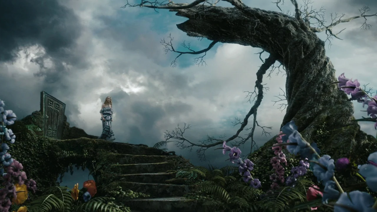 Alice in Wonderland (2010) movie still: wide — A stone staircase rises towards a weathered wooden door standing in a dark landscape. A woman in a…