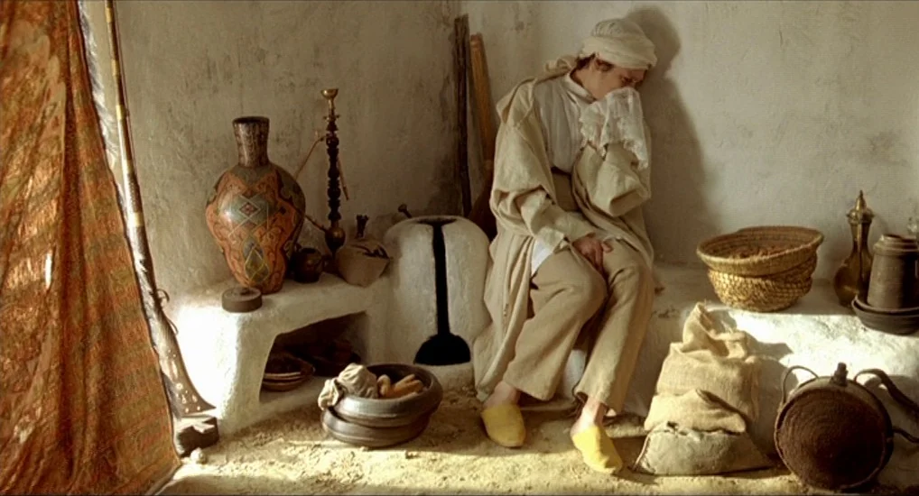 The Last Mistress (2007) movie still: medium — A small plaster room features a raised stone bench filled with various earthenware vessels. A woman…