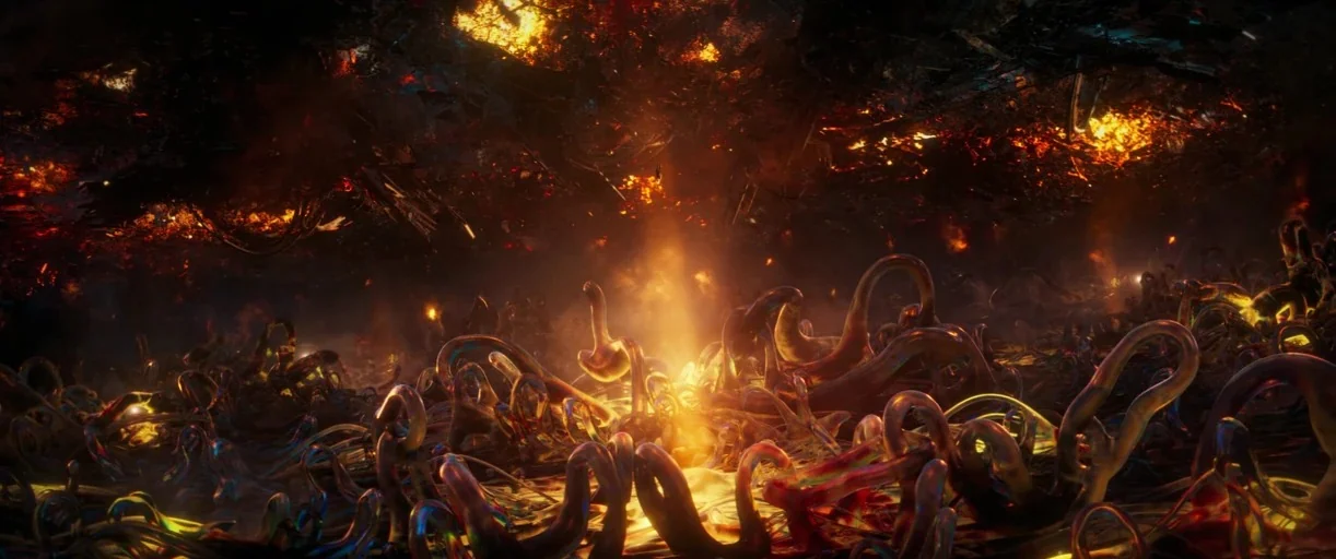 Ant-Man and the Wasp: Quantumania (2023) movie still: wide — An alien landscape features sprawling, reflective, serpentine tentacles emerging from a…