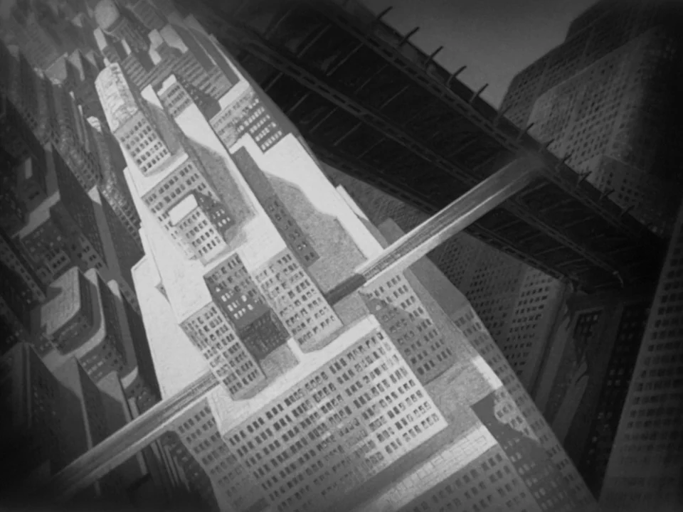 Metropolis (1927) movie still: establishing — A dense urban metropolis filled with towering skyscrapers and intersecting elevated transit bridges.…