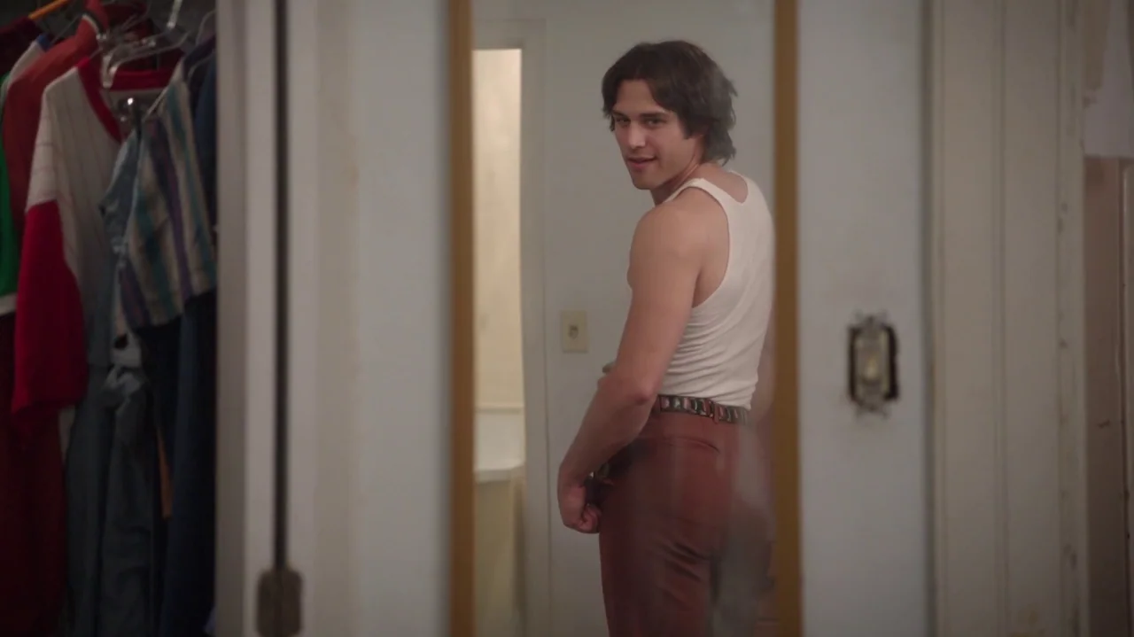Everybody Wants Some!! (2016) movie still: medium — A man stands in front of a mirror within a small, light-colored closet space. He wears a tank…