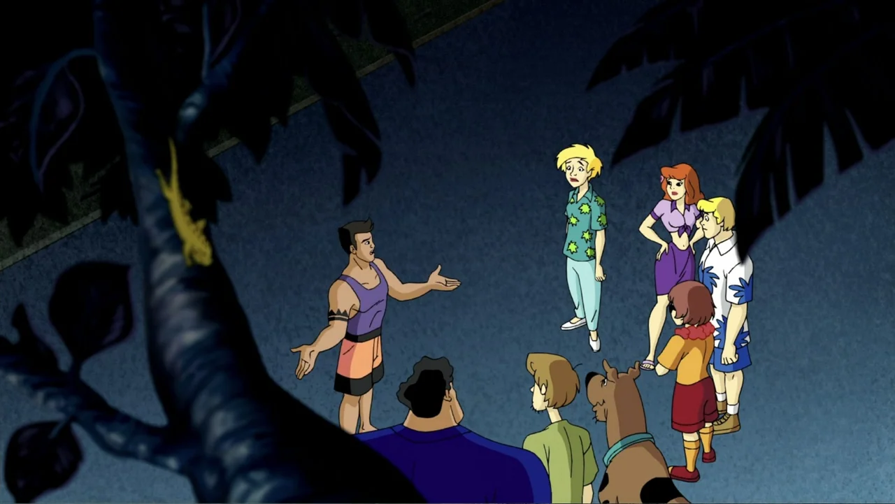 Aloha Scooby-Doo! (2005) movie still: wide — A group of six people and a dog stand on a dark paved outdoor area. A muscular man stands apart…