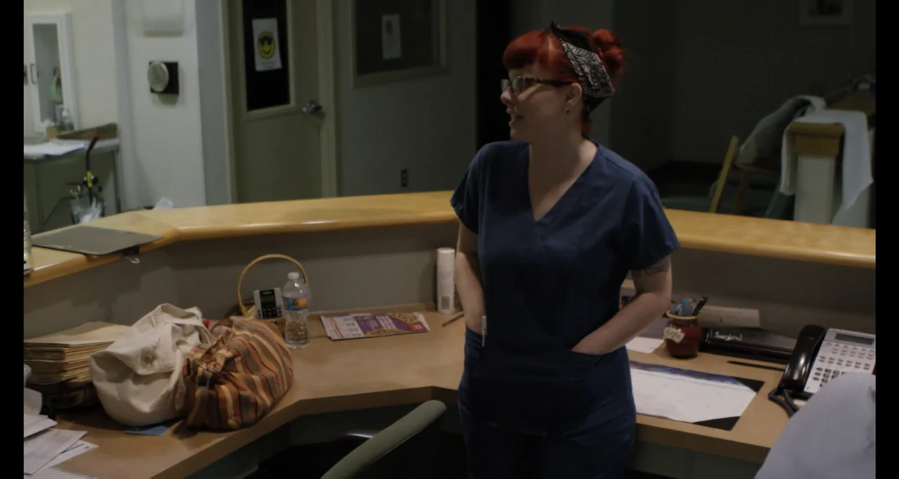 Abortion: Stories Women Tell (2016) movie still: medium — A hospital nurses station with laminate countertops holds patient files and office…