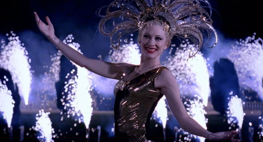 The Man Who Cried (2000) movie still: medium — A nighttime outdoor event featuring multiple white pyrotechnic fountain displays against a dark…