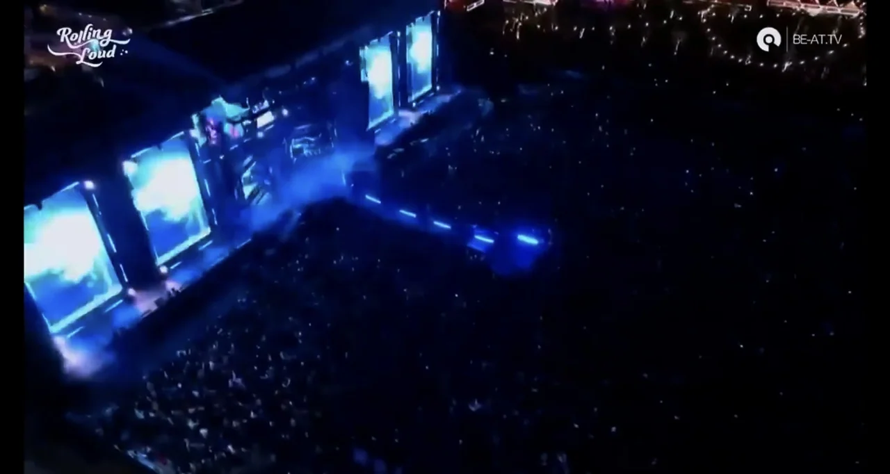 Juice WRLD: Into the Abyss (2021) movie still: establishing — A massive outdoor music festival at night seen from a high aerial perspective.…