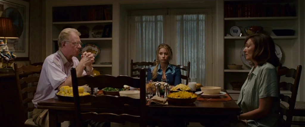 Pineapple Express (2008) movie still: medium — A wood-paneled dining area features built-in white bookshelves filled with various decorative items.…