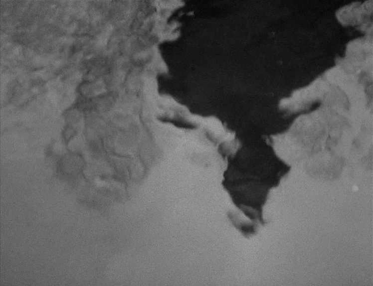 Prison (1949) movie still: establishing — The frame shows a rippling body of water from beneath the surface. A dark, indistinct shape floats…