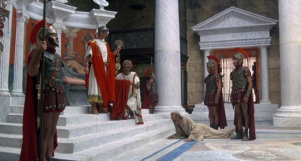 Life of Brian (1979) movie still: wide — An ornate Roman interior features marble columns, pediments, and painted classical-style wall murals. An…