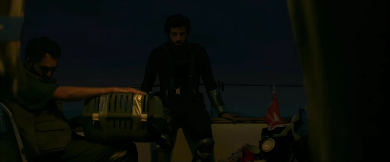 Apocalypse Z: The Beginning of the End (2024) movie still: medium — A dimly lit boat deck at twilight features a man standing near the railing. A…