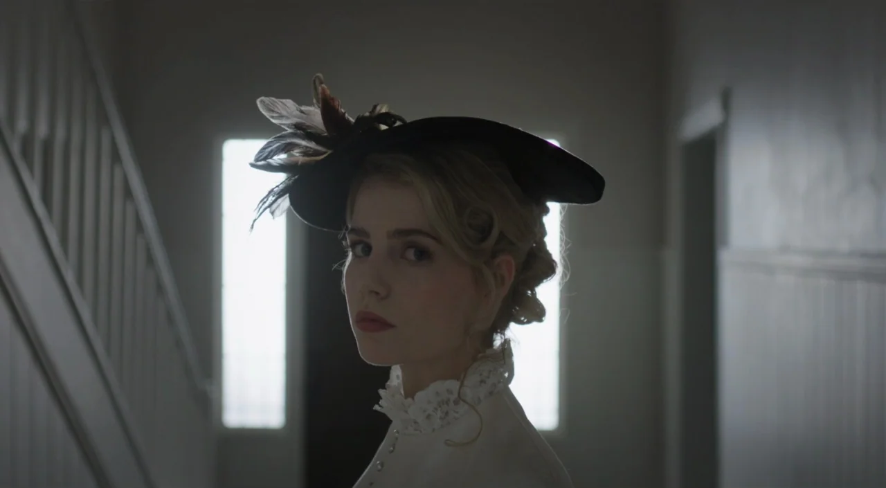 I Am The Pretty Thing That Lives In The House (2016) movie still: closeup — A dimly lit interior stairwell with a bright window visible in the…