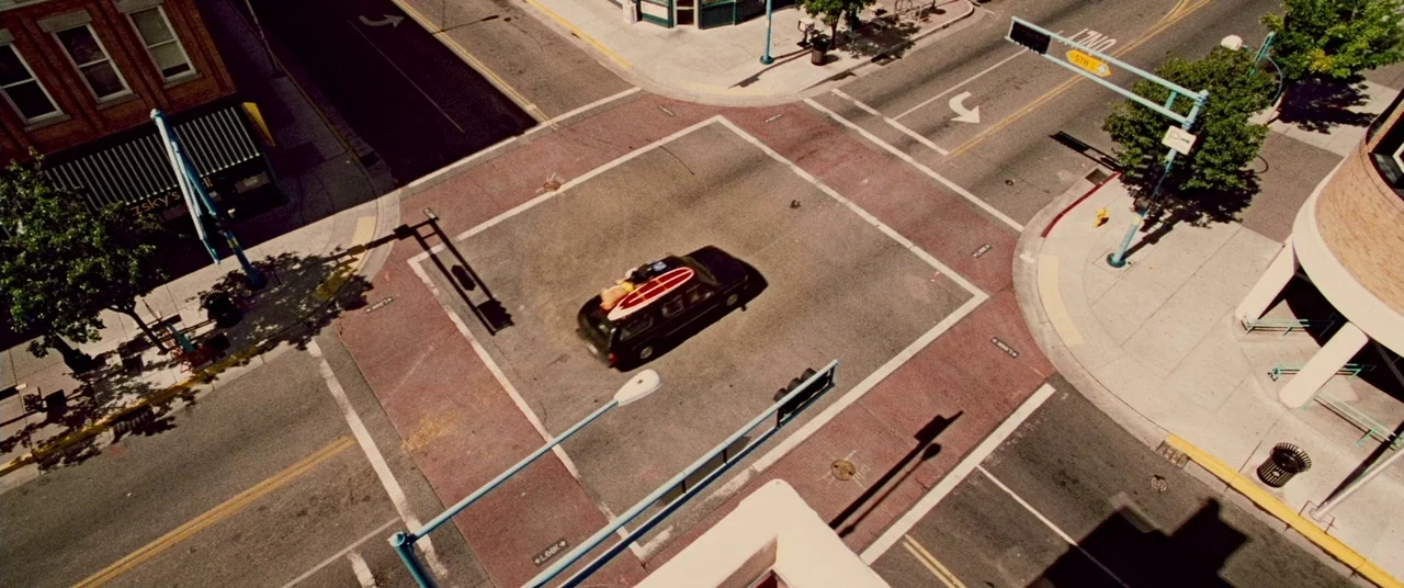 Carriers (2009) movie still: establishing — An urban intersection seen from an extremely high-angle perspective looking directly downward at…