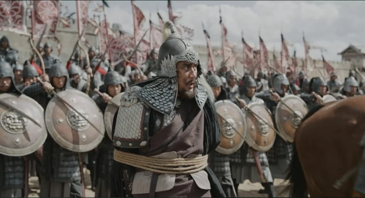 Legends of the Condor Heroes: The Gallants (2025) movie still: medium — A field filled with many soldiers holding wooden round shields and banners…