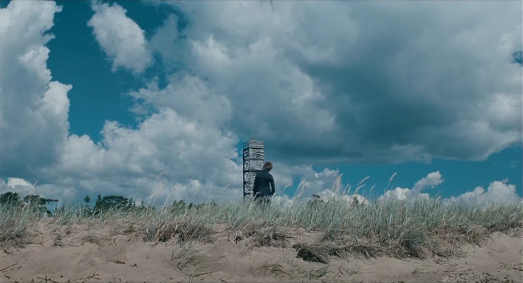 The Lord of The Rings: The Return of the King (2003) movie still: wide — A sandy beach landscape with patches of tall beach grass under a cloudy…