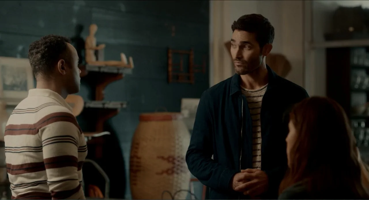 Can You Keep a Secret? (2019) movie still: medium — A shop interior features dark paneled walls and a large woven basket on the floor. Three people…