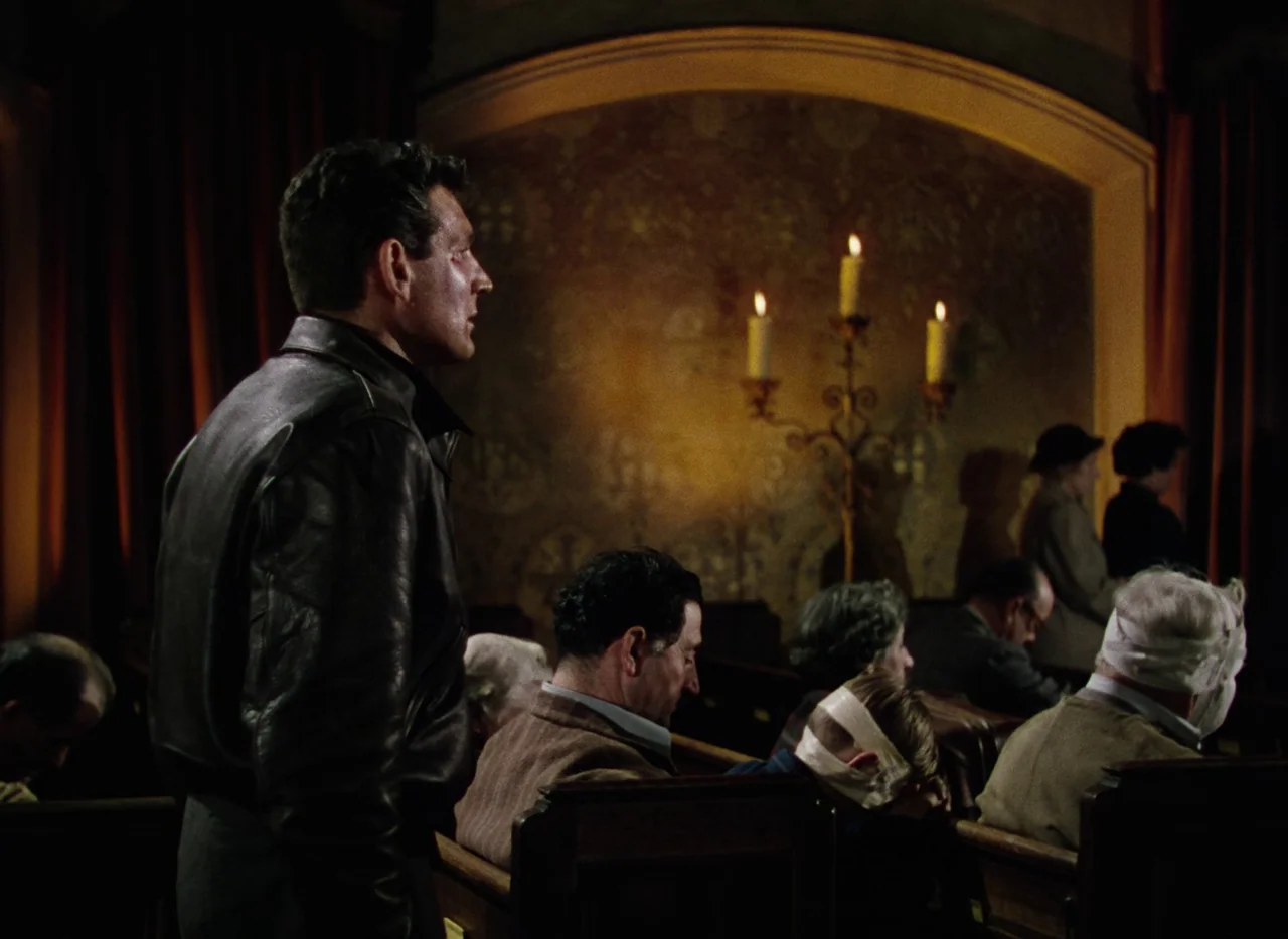 The War of the Worlds (1953) movie still: medium — A dark church interior contains rows of pews and an ornate candle holder.