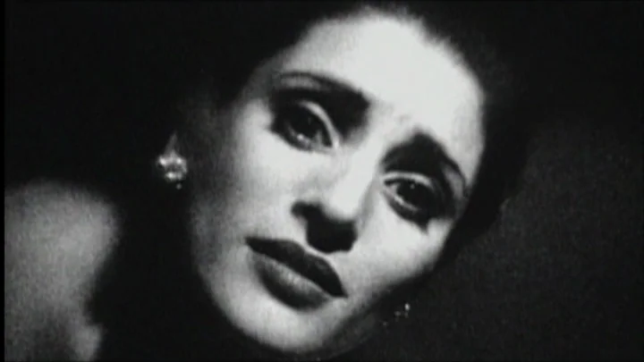 Dracula: Pages from a Virgin’s Diary (2002) movie still: closeup — A high-contrast black and white closeup captures the face of a woman in darkness.…