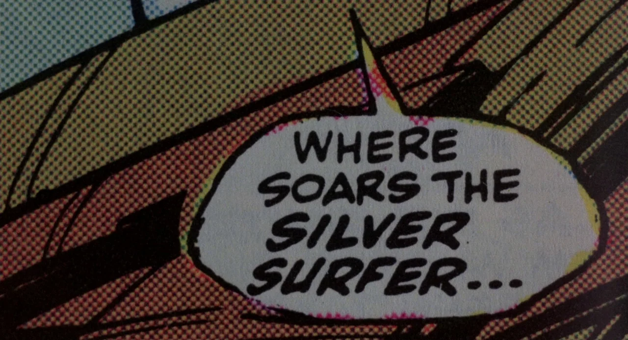 Breathless (1983) movie still: closeup — A comic book panel frame features a white speech bubble with black text. The text reads WHERE SOARS THE…
