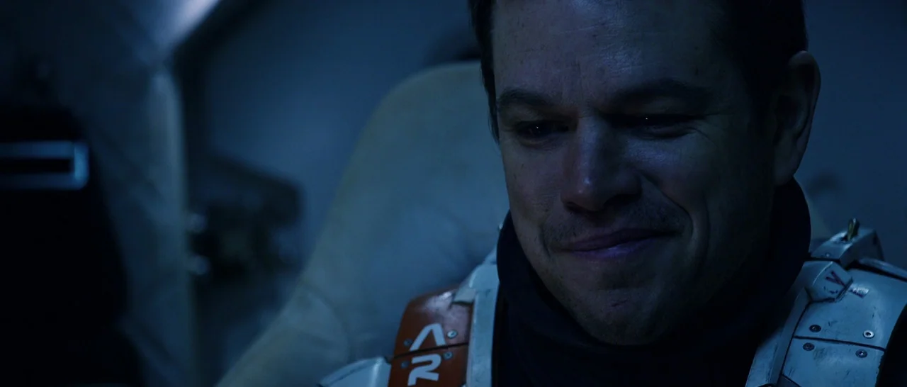 The Martian (2015) movie still: closeup — A dimly lit, cramped cabin inside a futuristic space vessel featuring complex technical hardware. An…