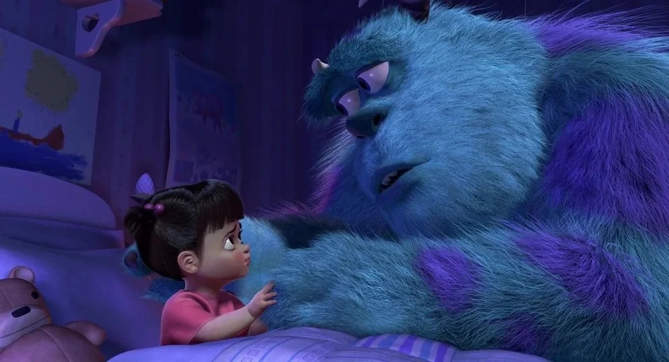 Monsters, Inc. (2001) movie still: medium — A dimly lit room with blue walls features a small bed and child's drawings. A large blue furry monster…