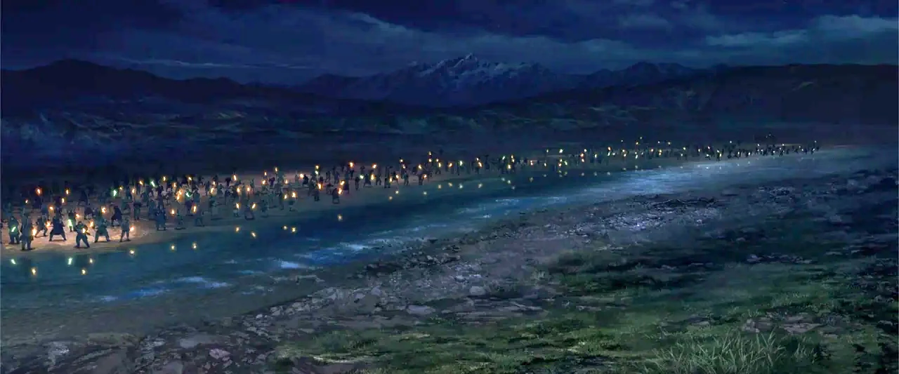 The Lord of the Rings: The War of the Rohirrim (2024) movie still: wide — A vast, dark riverbank at night features a long line of torch-bearing…