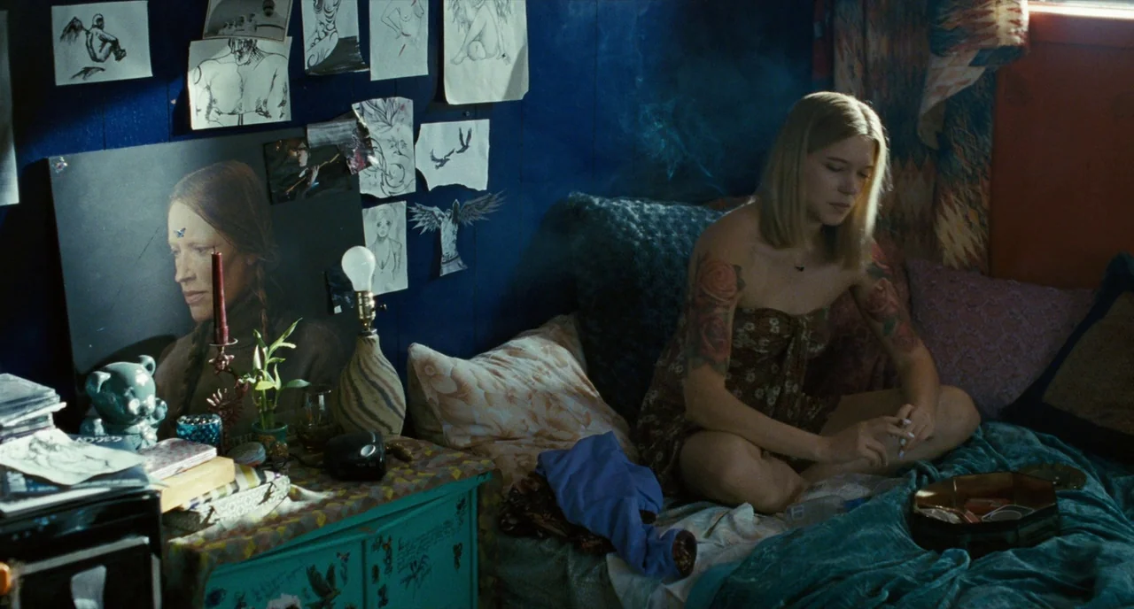 It’s Only The End Of The World (2016) movie still: medium — A small bedroom features dark blue walls covered with various sketches and drawings. A…