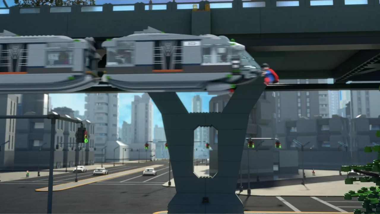 LEGO DC: Shazam! Magic and Monsters (2020) movie still: wide — A Lego-style city features an elevated train track crossing a multi-lane…