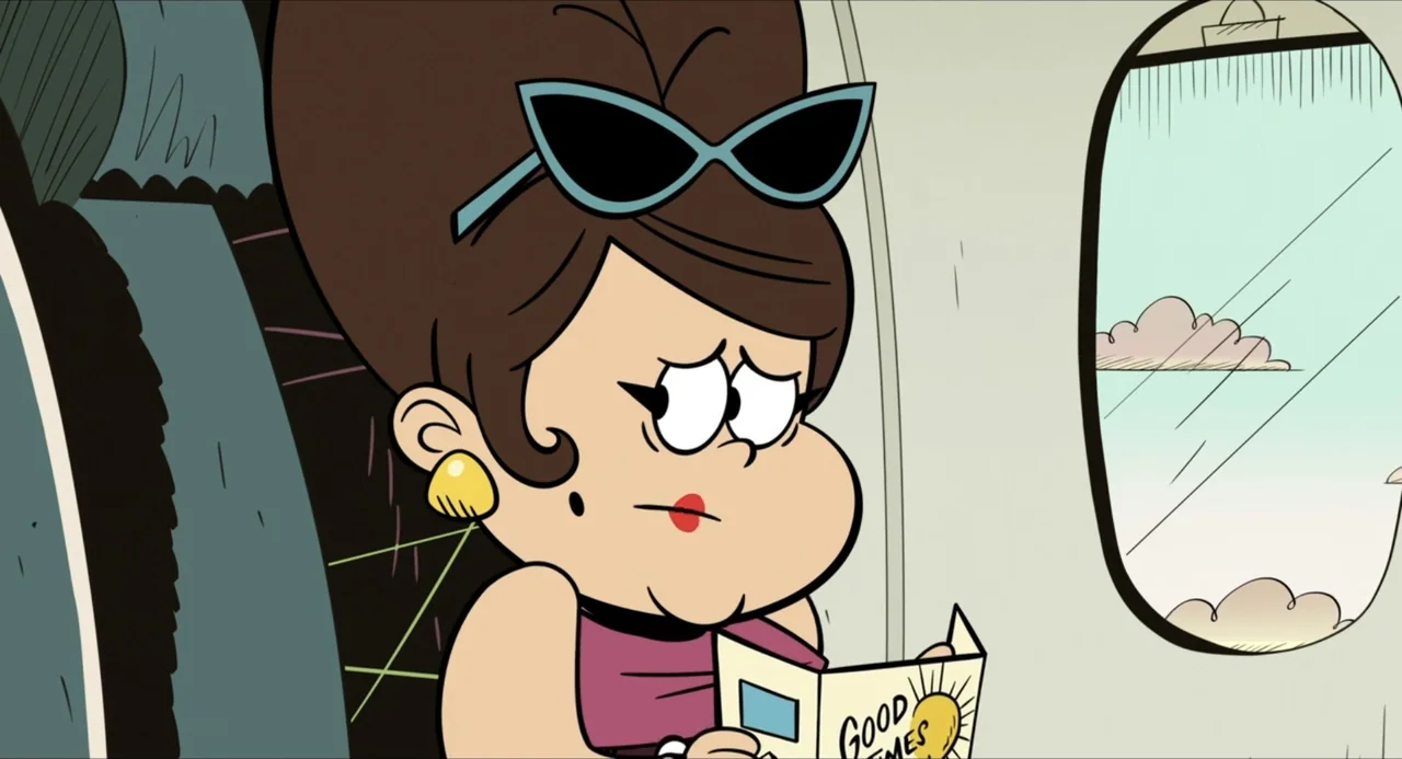 No Time to Spy: A Loud House Movie (2024) movie still: medium — An interior airplane cabin with a small oval window looking out at clouds. A woman…