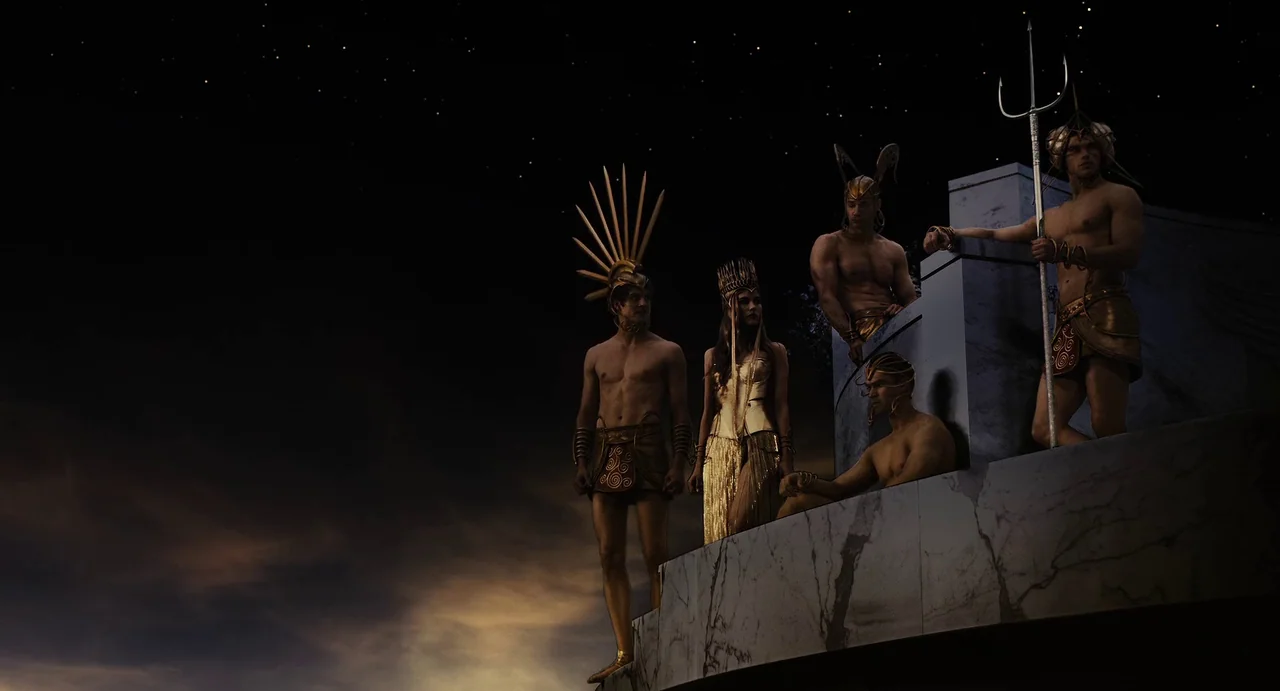 The Immortals (2011) movie still: wide — A group of five figures in golden mythical armor stands atop a marble structure. They look out over a vast,…