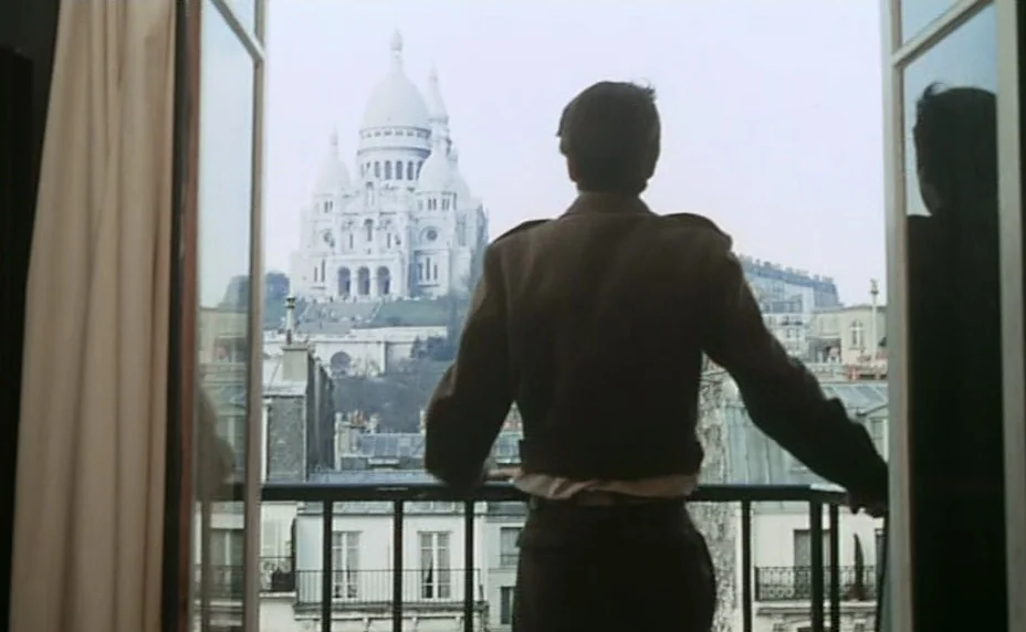 Stolen Kisses (1968) movie still: medium — A man stands on a residential balcony in Paris looking out toward a cathedral. The Sacre-Coeur Basilica…