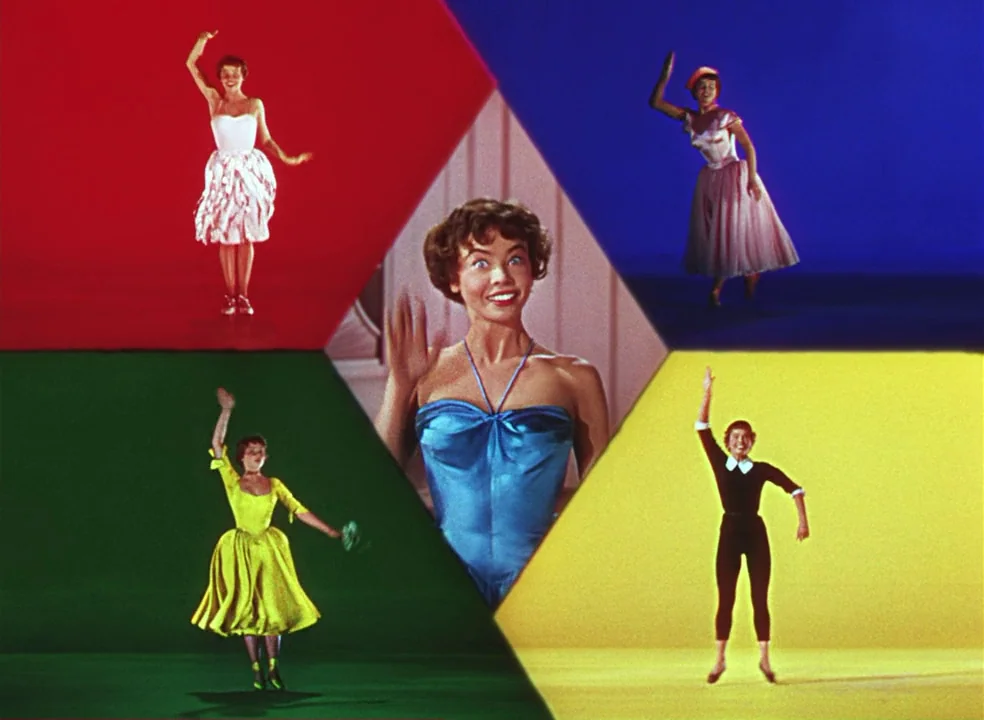 An American In Paris (1951) movie still: wide — A studio stage is divided into geometric colored sections representing red, blue, green, and yellow.…