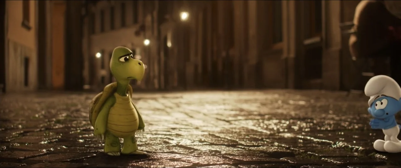 Smurfs (2025) movie still: medium — A wet cobblestone street at night is illuminated by distant streetlamp light. A small green turtle character…